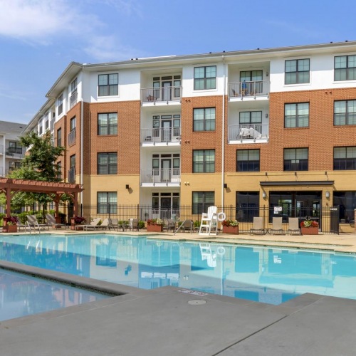 a swimming pool in front of a building